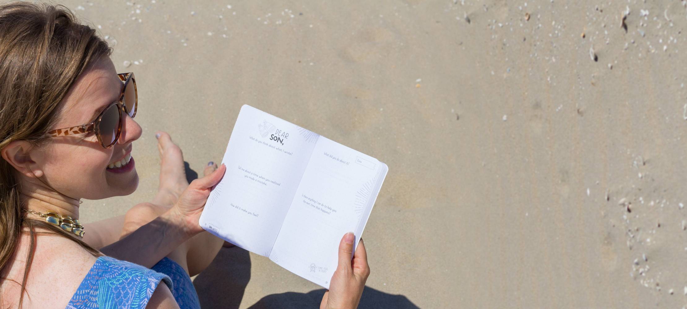 Katie with journal at beach