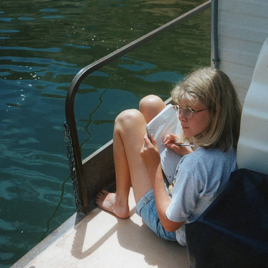 Katie writing on houseboat